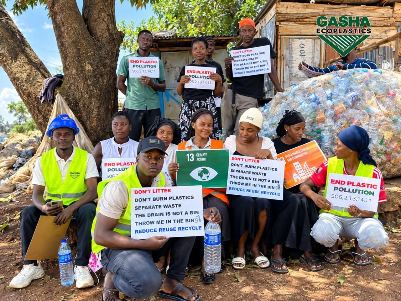 Awareness group holding anti-plastic-pollution signs