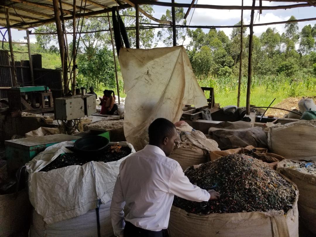 Sacks of shredded plastic at a recycling workshop