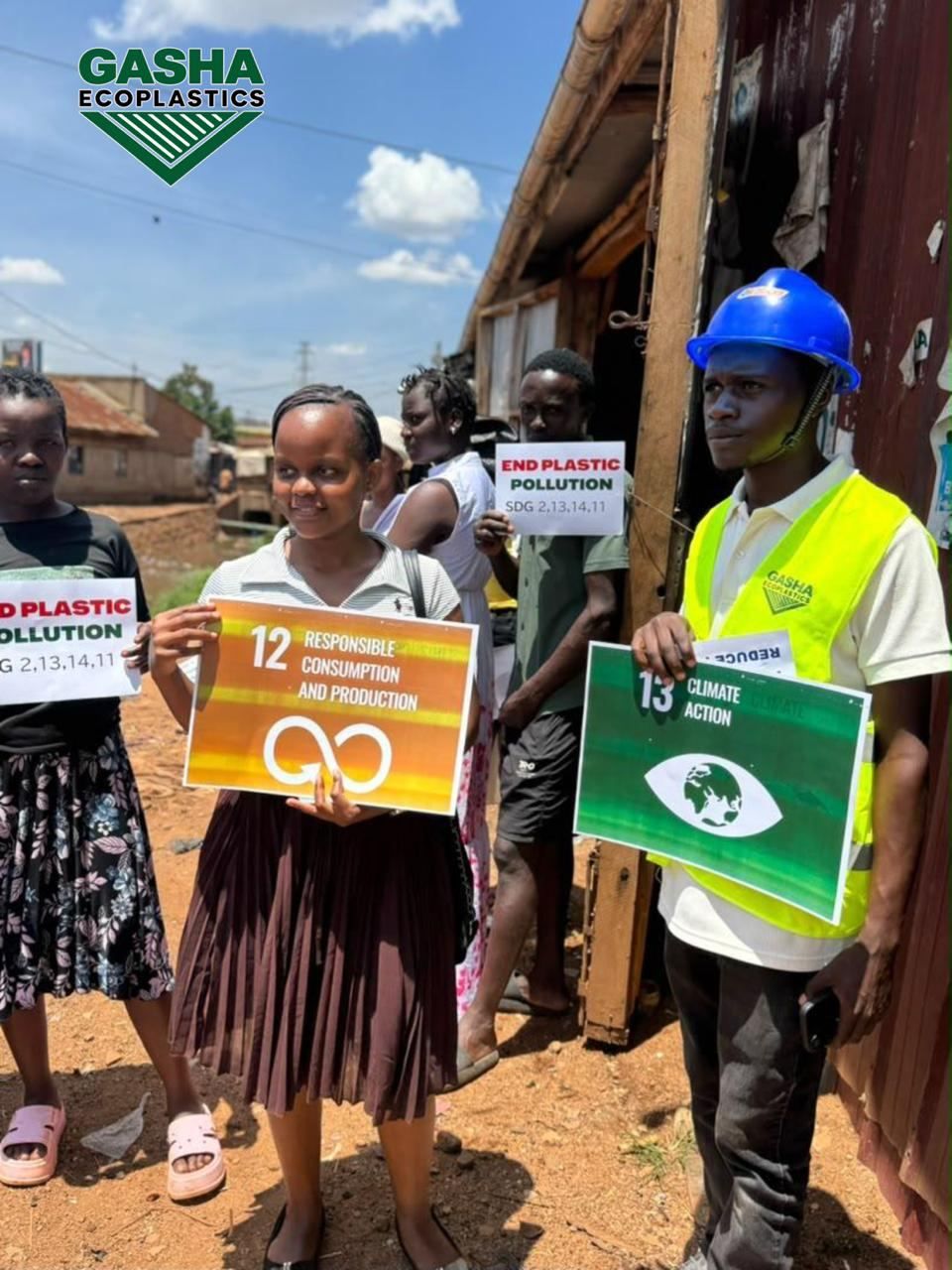 Holding SDG 12 and 13 signs